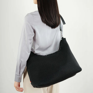 Le sac à bandoulière « DEMI »